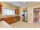 Bright kitchen featuring stainless steel appliances, wood cabinetry, and plenty of counter space at 2620 Central Ave, Indianapolis, IN 46205