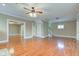 Open-concept living room featuring hardwood floors, neutral paint, and staircase to the second floor at 2620 Central Ave, Indianapolis, IN 46205