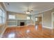 Spacious living room with hardwood floors, fireplace, built-in shelving, and natural light at 2620 Central Ave, Indianapolis, IN 46205