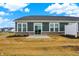 New home's backyard featuring a patio, sliding glass door, and horizontal siding at 268 Onset Way, Westfield, IN 46074