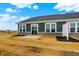 A new home's backyard with patio, horizontal siding, white trim, and freshly tilled soil at 268 Onset Way, Westfield, IN 46074