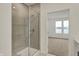 Modern bathroom with a glass-enclosed shower, complemented by a view into an adjacent room at 268 Onset Way, Westfield, IN 46074