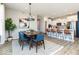Elegant dining area open to the kitchen with modern lighting and stylish furniture at 268 Onset Way, Westfield, IN 46074