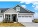 Charming two-story home featuring a two-car garage and covered porch with stone accents and stylish gray siding at 268 Onset Way, Westfield, IN 46074