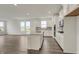 Modern kitchen with white cabinetry, stainless steel appliances, kitchen island and hardwood-style floors at 268 Onset Way, Westfield, IN 46074