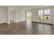 Spacious living room featuring stylish flooring, lots of natural light, and sliding glass door to patio at 268 Onset Way, Westfield, IN 46074