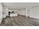 An open living area with hardwood floors seamlessly connects the living room, dining space, and kitchen at 268 Onset Way, Westfield, IN 46074
