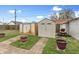 This backyard features a shed, lawn tractor, and mature trees at 2709 S Mcclure St, Indianapolis, IN 46241