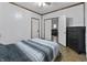 Cozy bedroom featuring a comfortable bed and ample closet space at 2709 S Mcclure St, Indianapolis, IN 46241