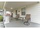 Relaxing front porch with comfortable seating, perfect for enjoying the outdoors at 2709 S Mcclure St, Indianapolis, IN 46241