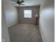 This bedroom features carpet, a window with blinds, and a lamp at 2735 Prosperity Dr, Columbus, IN 47201