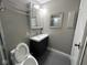 Contemporary bathroom featuring a vanity with mosaic tile and a decorative mirror at 2765 Del Prado Dr # 7, Indianapolis, IN 46227