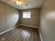 Comfortable bedroom with ceiling fan and wood-look floors at 2765 Del Prado Dr # 7, Indianapolis, IN 46227