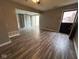 Open-concept living room with tile floors, closet, and sliding glass doors to back yard at 2765 Del Prado Dr # 7, Indianapolis, IN 46227