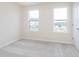 Bright bedroom with two windows and neutral carpet at 3308 Morab Dr, Zionsville, IN 46077