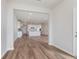 Open-concept kitchen featuring an island and stainless steel appliances and wood-style flooring at 3308 Morab Dr, Zionsville, IN 46077