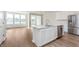 Open concept kitchen with a center island, stainless steel appliances, and abundant natural light at 3308 Morab Dr, Zionsville, IN 46077