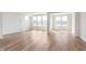 Bright living room with large windows, hardwood flooring, and plenty of natural light at 3308 Morab Dr, Zionsville, IN 46077