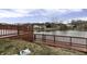 A spacious wooden deck overlooks the tranquil lake and surrounding trees at 3701 Dorval Pl, Indianapolis, IN 46228