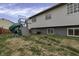 A spacious backyard with a playset and a home with many windows at 3701 Dorval Pl, Indianapolis, IN 46228