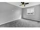 Bright bedroom featuring carpeting, large window, and ceiling fan at 3701 Dorval Pl, Indianapolis, IN 46228