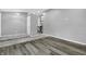 Hallway with wood and tile flooring, leading to stairs at 3701 Dorval Pl, Indianapolis, IN 46228
