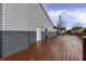 Large wooden deck next to a two-story home provides ample space for outdoor entertaining at 3701 Dorval Pl, Indianapolis, IN 46228