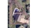 Aerial view of a property highlighting the expansive 15,144 sq ft lot with a pool and surrounding landscape at 3998 Jonathan Rdg, Columbus, IN 47201