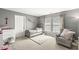 Comfortable bedroom featuring a cozy chair, a twin bed, and ample natural light at 3998 Jonathan Rdg, Columbus, IN 47201