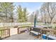 Spacious wooden deck with outdoor seating overlooking a backyard with a pool at 3998 Jonathan Rdg, Columbus, IN 47201