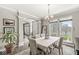 Bright dining room with large windows and views of the front yard at 3998 Jonathan Rdg, Columbus, IN 47201