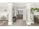 Inviting entryway with decorative columns and a view into the living room at 3998 Jonathan Rdg, Columbus, IN 47201