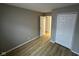 Comfortable bedroom with wood-look floors and closet space; ideal for relaxation at 4047 Biscayne Rd, Indianapolis, IN 46226