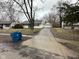Ranch-style home with detached garage and a long driveway at 4047 Biscayne Rd, Indianapolis, IN 46226