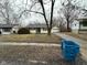 Traditional ranch-style home with detached garage and a well-maintained lawn at 4047 Biscayne Rd, Indianapolis, IN 46226