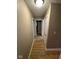 Hallway featuring laminate flooring and white doors at 4047 Biscayne Rd, Indianapolis, IN 46226