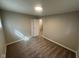 Cozy bedroom with neutral paint, carpet floors, and a window providing natural light at 4224 N Arlington Ave, Indianapolis, IN 46226