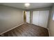 Bedroom with carpeted floor, closet, neutral paint, and access to adjacent room at 4224 N Arlington Ave, Indianapolis, IN 46226