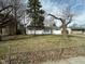 Charming single-story home featuring a well-maintained lawn and mature trees in a suburban setting at 4224 N Arlington Ave, Indianapolis, IN 46226