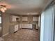 Beautiful kitchen featuring white cabinetry, a large sink, new fixtures, and lots of natural light at 4224 N Arlington Ave, Indianapolis, IN 46226