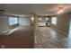 Open-concept view of living space and the kitchen, with ample counter space and natural light at 4224 N Arlington Ave, Indianapolis, IN 46226