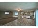 Bright, open floor plan featuring a modern kitchen with white cabinetry and eat in breakfast nook at 4224 N Arlington Ave, Indianapolis, IN 46226