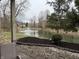 Scenic backyard view overlooking the pond with a fountain and well-maintained landscaping at 4480 Village Ln # 2, Indianapolis, IN 46254
