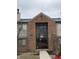 Brick building entrance featuring large glass windows and visible unit number at 4480 Village Ln # 2, Indianapolis, IN 46254