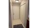 Welcoming entryway featuring a large front door, neutral tile flooring, and ample closet space at 4480 Village Ln # 2, Indianapolis, IN 46254