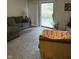 Bright living room with a comfortable sectional couch and sliding glass doors to a patio at 4480 Village Ln # 2, Indianapolis, IN 46254
