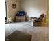 Spacious living room featuring plush carpet and a view of the outdoors at 4480 Village Ln # 2, Indianapolis, IN 46254