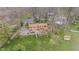 Birds-eye view of a house with an expansive backyard and a detached storage shed at 4935 W Carriage Dr, New Palestine, IN 46163