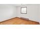 Bedroom with hardwood floors and a window offering ample natural light at 4935 W Carriage Dr, New Palestine, IN 46163