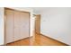 Bedroom with hardwood floors, a closet and a door at 4935 W Carriage Dr, New Palestine, IN 46163